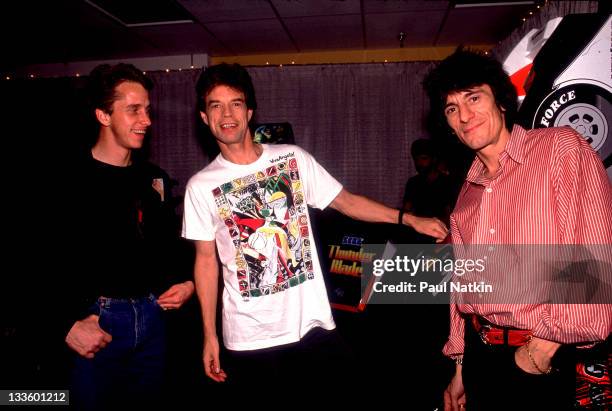 Backstage at the Rolling Stones' 'Steel Wheels' tour, British musicians Mick Jagger and Ron Wood of the Rolling Stones poses with American cycling...