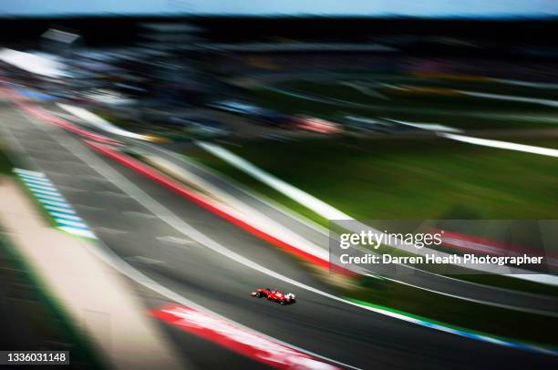 Spanish Scuderia Ferrari Formula One team racing driver Fernando Alonso driving his F2012 racing car through the final corner of the circuit and on...