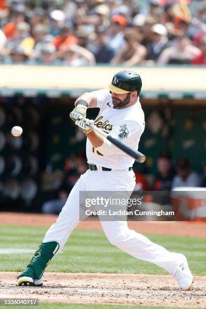 Mitch Moreland of the Oakland Athletics at bat against the San Francisco Giants at RingCentral Coliseum on August 21, 2021 in Oakland, California.