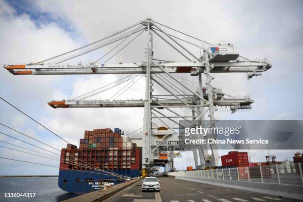 Containers sit stacked on a cargo ship berthed at the Port of Le Havre on August 13, 2021 in Le Havre, France.