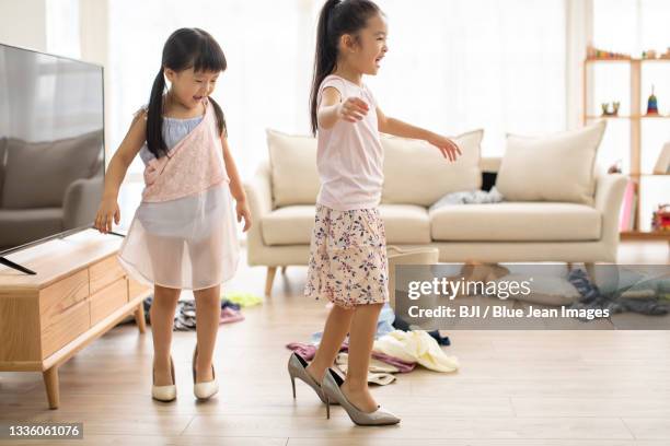 cute chinese children dressing up like adults - child high heels stock pictures, royalty-free photos & images