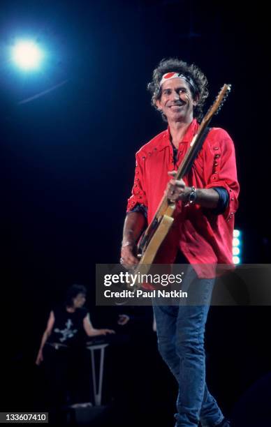 British musician Keith Richards of the Rolling Stones performs on stage during the band's 'Voodoo Lounge' tour, late 1994.