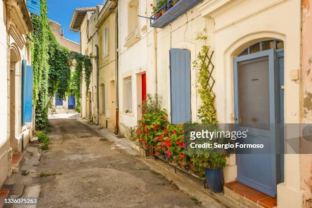 picturesque street in arles old town, provence, france. - arles stock-fotos und bilder