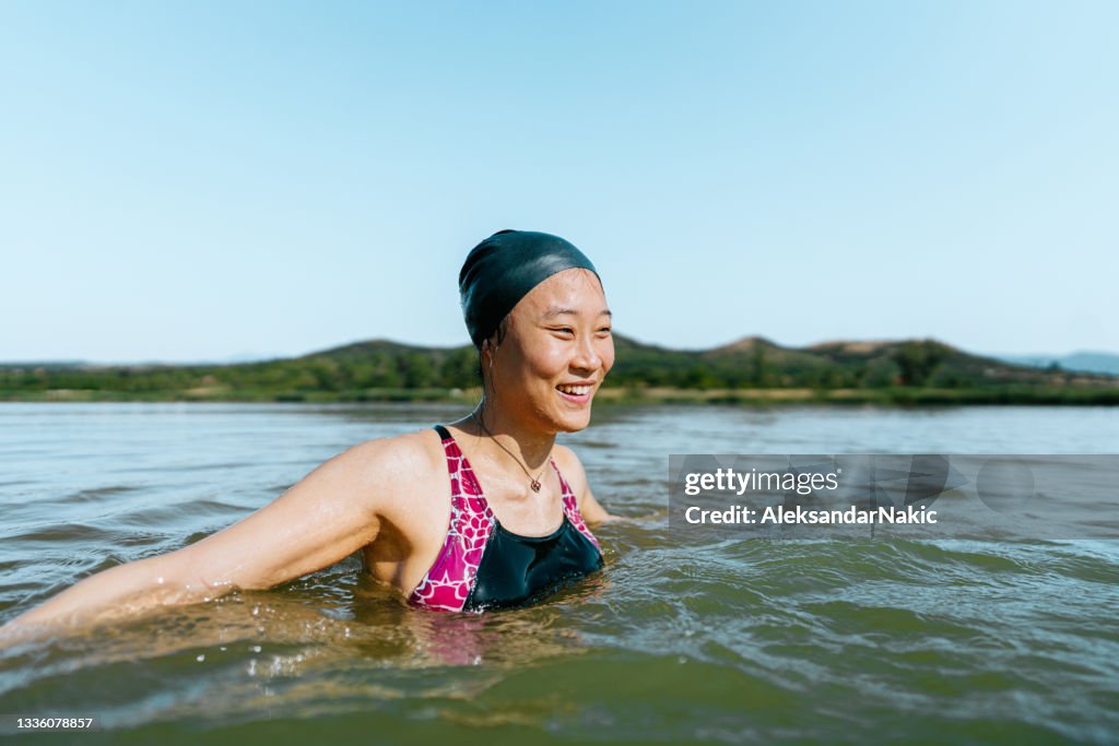 Portrait of a beautiful swimmer in the lake