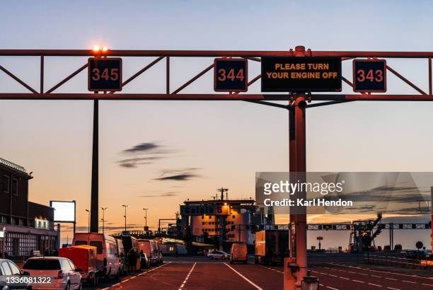 a dusk view of the port of calais, france - stock photo - calais stock pictures, royalty-free photos & images
