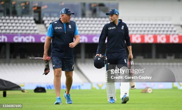 England captain Joe Root speaks to coach Chris Silverwood during a nets session at Emerald Headingley Stadium on August 24, 2021 in Leeds, England.