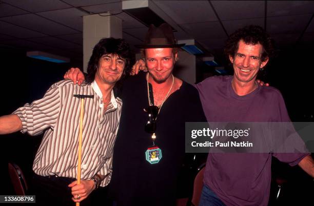 Backstage at the Rolling Stones' 'Voodoo Lounge' tour, British musicians Ron Wood and Keith Richards of the Rolling Stones poses with American...
