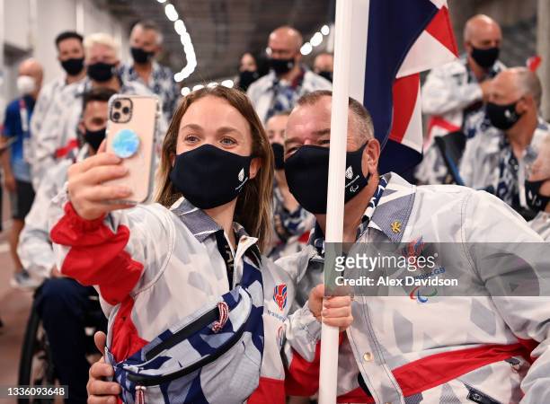 Flag bearers Eleanor Simmonds and John Stubbs of Team Great Britain pose ahead of the parade of athletes during the opening ceremony of the Tokyo...