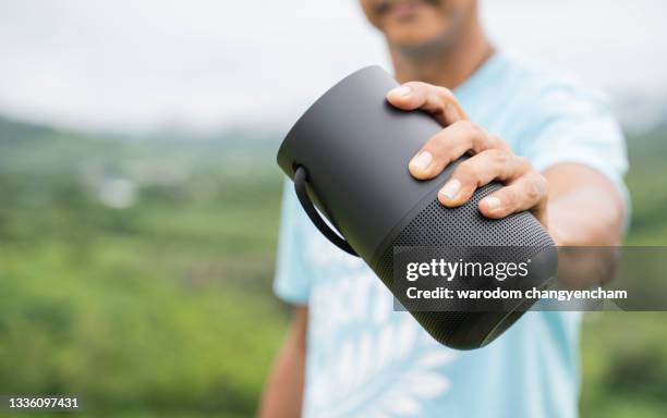 men using a smart speaker - bluetooth stock pictures, royalty-free photos & images