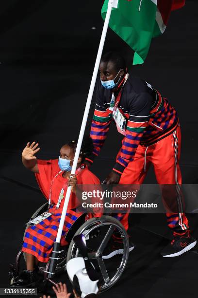 Flag bearer Hellen Wawira Kariuki of Team Kenya leads her delegation in the parade of athletes during the opening ceremony of the Tokyo 2020...
