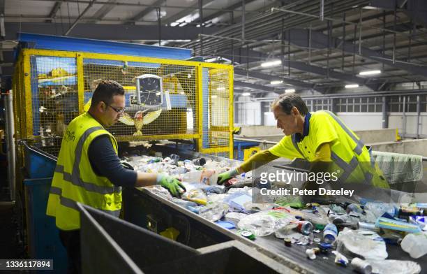 Employees sort waste at the Lampton 360 Recycling Centre on August 18,2021 in London, United Kingdom. Lampton 360 Recycling Centre Recycle 360 was...