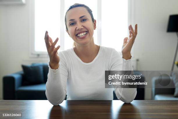 woman talking during video call - online presenter stock pictures, royalty-free photos & images