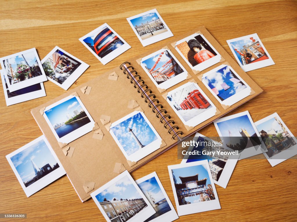Collection of instant travel holiday photos in a photo album