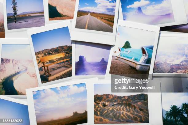 collection of instant travel holiday photos on a table - fotografía producto de arte y artesanía fotografías e imágenes de stock