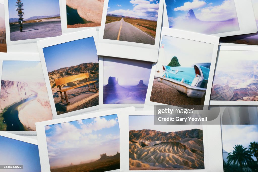 Collection of instant travel holiday photos on a table