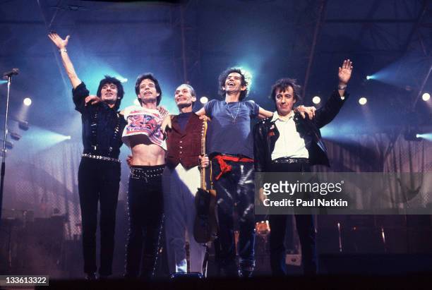 The Rolling Stones wave from the stage following a performance during their 'Steel Wheels' tour, late 1989. Pictured are, from left, Ron Wood, Mick...