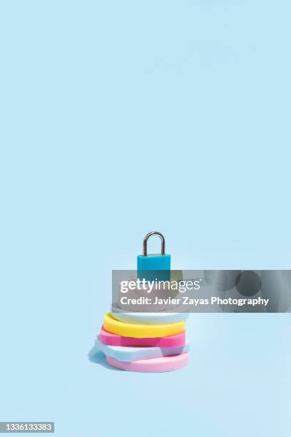 blue padlock on blue background - password strength stock pictures, royalty-free photos & images