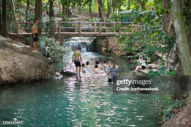 bathing thai people in  river of ban tha chang spring in khao yai - river bathing imagens e fotografias de stock