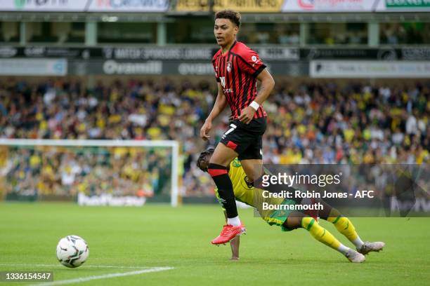 Morgan Rogers of Bournemouth and Bali Mumba of Norwich City during the Carabao Cup 2nd Round match between Norwich FC and AFC Bournemouth at Carrow...