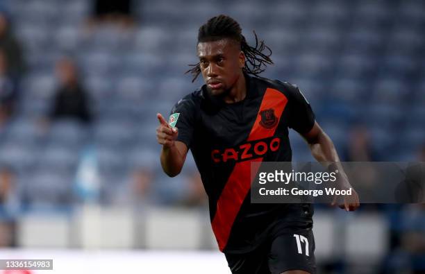 Alex Iwobi of Everton celebrates after scoring the first goal during the Carabao Cup second round match between Huddersfield Town and Everton at the...