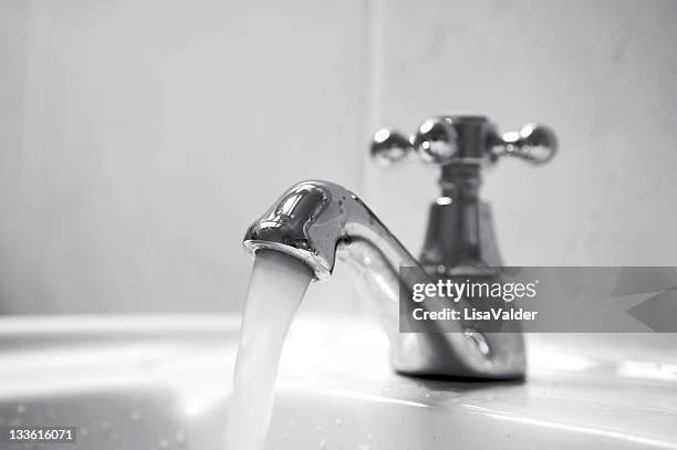 running water - water faucet stock pictures, royalty-free photos & images