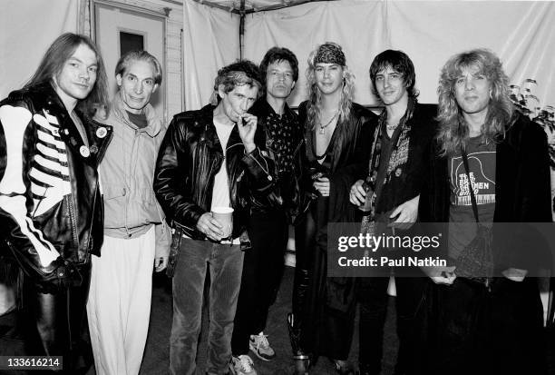 Backstage at the Rolling Stones' 'Steel Wheels' tour, The Rolling Stones pose with the the band Guns 'n Roses, late 1989. Pictured are, from left,...