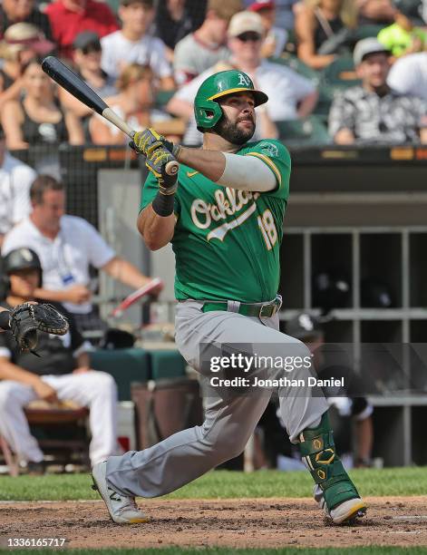 Mitch Moreland of the Oakland Athletics bats against the Chicago White Sox at Guaranteed Rate Field on August 19, 2021 in Chicago, Illinois. The...