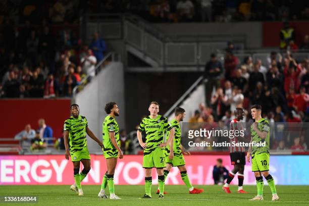 Regan Hendry of Forest Green Rovers and teammates look dejected after Brentford's second goal during the Carabao Cup Second Round match between...