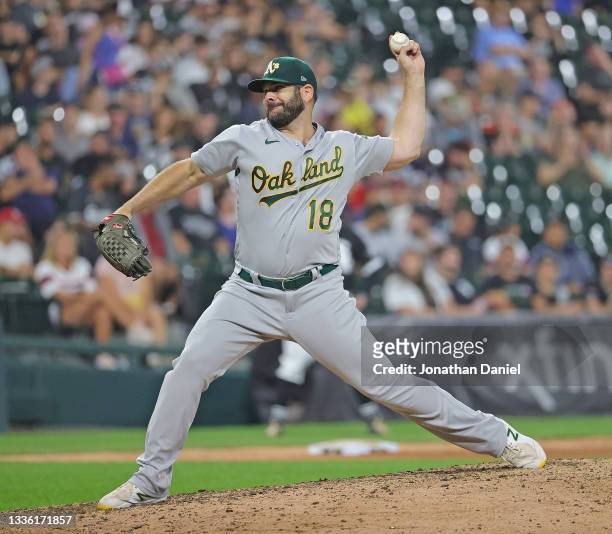 Mitch Moreland of the Oakland Athletics pitches against the Chicago White Sox at Guaranteed Rate Field on August 17, 2021 in Chicago, Illinois. The...