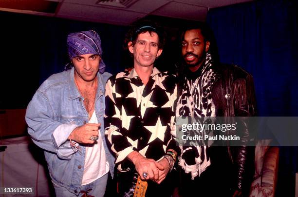 Backstage at the Rolling Stones' 'Steel Wheels' tour, British musician Keith Richards of the Rolling Stones poses with American musicians Steven Van...