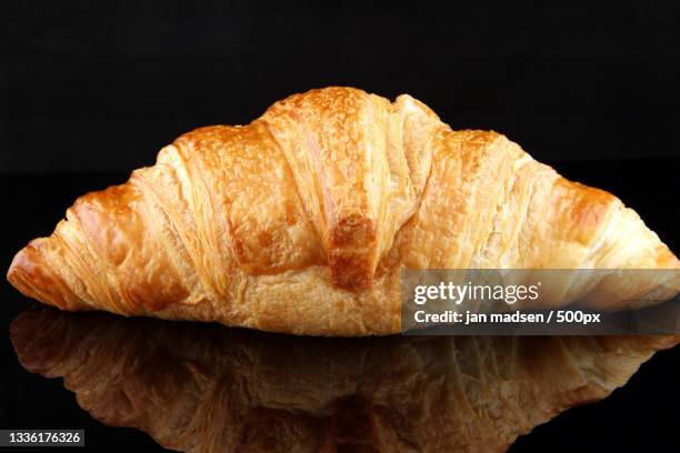 close-up of croissant against black background,denmark - close up bread roll black backdrop horizontal stock pictures, royalty-free photos & images