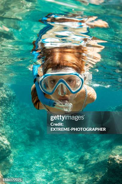 portrait of a girl snorkeling - underwater camera stock pictures, royalty-free photos & images