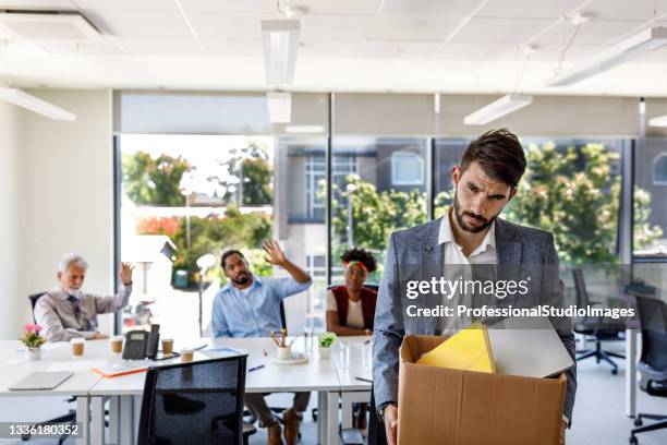 a man failed at the job and leaving the office. - unemployment benefits stock pictures, royalty-free photos & images