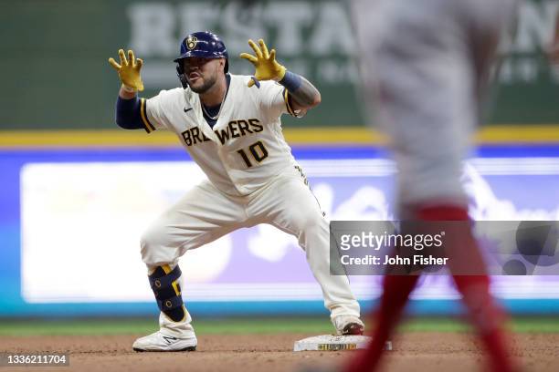Omar Narvaez of the Milwaukee Brewers celebrates a run-scoring single in the seventh inning against the Cincinnati Reds at American Family Field on...