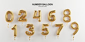 Isolate of golden number balloon 0 to 9 on white background for decorate merry Christmas , Happy new year ,valentine's day and Birthday cerebration party by 3D rendering.