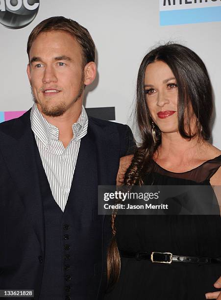 Singer Alanis Morissette and Mario “MC Souleye” Treadway arrive at the 2011 American Music Awards held at Nokia Theatre L.A. LIVE on November 20,...