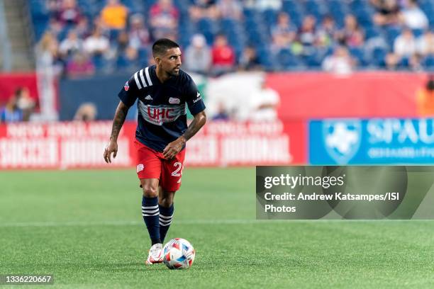DeLaGarza of New England Revolution looks to pass during a game between D.C. United and New England Revolution at Gillette Stadium on August 18, 2021...