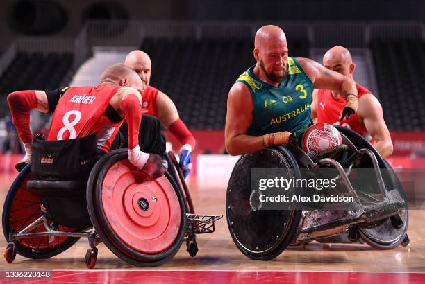 Ryley Batt of Team Australia breaks past Jesper Ring Kruger of team Denmark to score during the Wheelchair Rugby Pool Phase Group a match between...