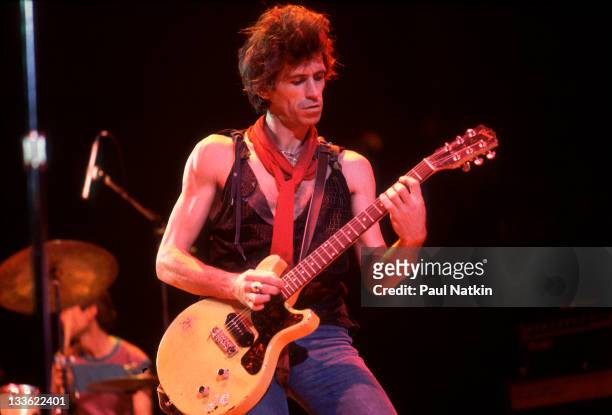 British musician Keith Richards of the band The Rolling Stones performs on stage during a North American tour, 1981.