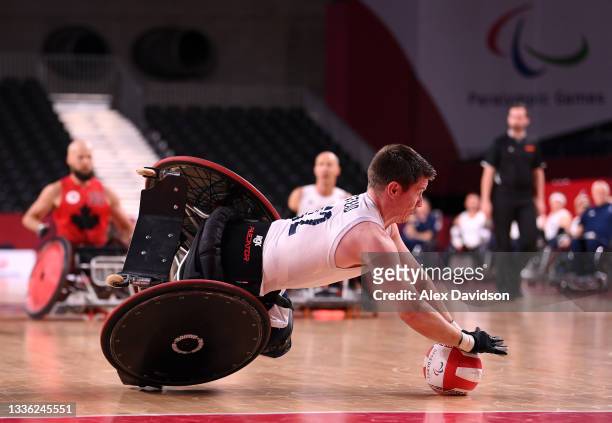 Jamie Stead of Team Great Britain falls to the floor after being tackled during the Wheelchair Rugby Pool Phase Group match between Team Great...