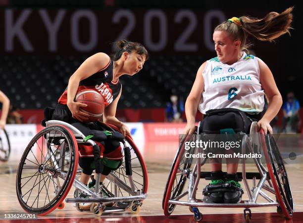 Mari Amimoto of Team Japan handles the ball against Hannah Dodd of Team Australia during the Women's Wheelchair Basketball Group A game on day 1 of...