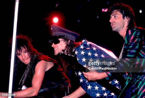American rock band Bon Jovi performs on stage, Illinois, early March, 1987. Pictured are, from left, Richie Sambora, Jon Bon Jovi, and Alec John Such.