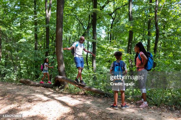 Father Log Group Of Kids Forest Walking Log Photos and Premium High Res Pictures ...