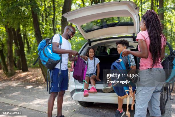 young african family getting ready for hiking from car - bilsemester bildbanksfoton och bilder