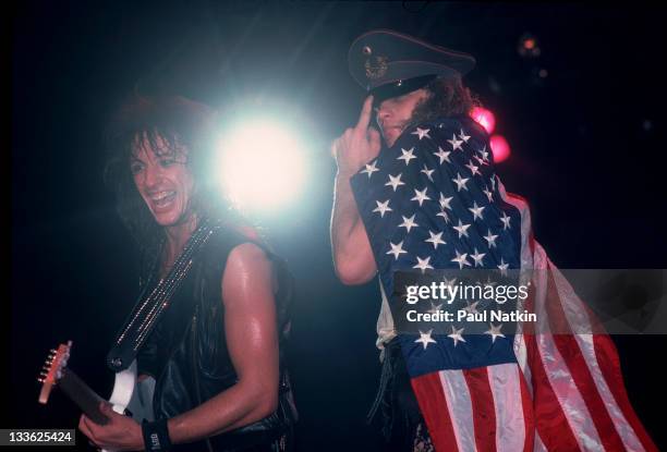 American musicians Richie Sambora and Jon Bon Jovi of the rock band Bon Jovi perform on stage, Illinois, early March, 1987.