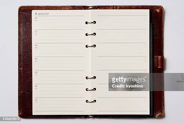 isolated shot of opened blank personal organizer on white background - week stock pictures, royalty-free photos & images