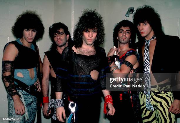 Portrait of American rock band Bon Jovi backstage before a performance at the Rosemont Horizon, Rosemont, Illinois, May 20, 1984. Pictured are, from...