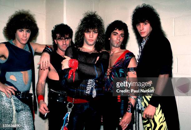 Portrait of American rock band Bon Jovi backstage before a performance at the Rosemont Horizon, Rosemont, Illinois, May 20, 1984. Pictured are, from...