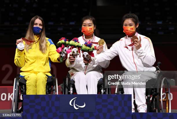 Silver medalist Olena Fedota of Team Ukraine, gold medalist Shumei Tan of Team China and bronze medalist Rong Xiao of Team China pose during the...