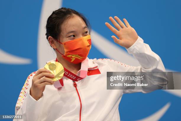 Zhang Li of Team China celebrates winning the gold medal in the women’s 200m Freestyle - S5 final on day 1 of the Tokyo 2020 Paralympic Games at...